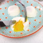 Poached eggs with gorgeous yellow runny egg yolk flowing out, made by steaming with silicone molds