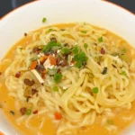 Creamy yellow Shin Ramyun instant noodles, with added egg and mayonaise in this super easy recipe