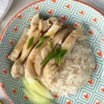 Hainanese Chicken Rice with sliced cucumber, made almost entirely with a rice cooker within 30 minutes