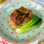 Claypot Chicken Rice with chinese sausage and shiitake mushrooms, made with a rice cooker in this easy recipe