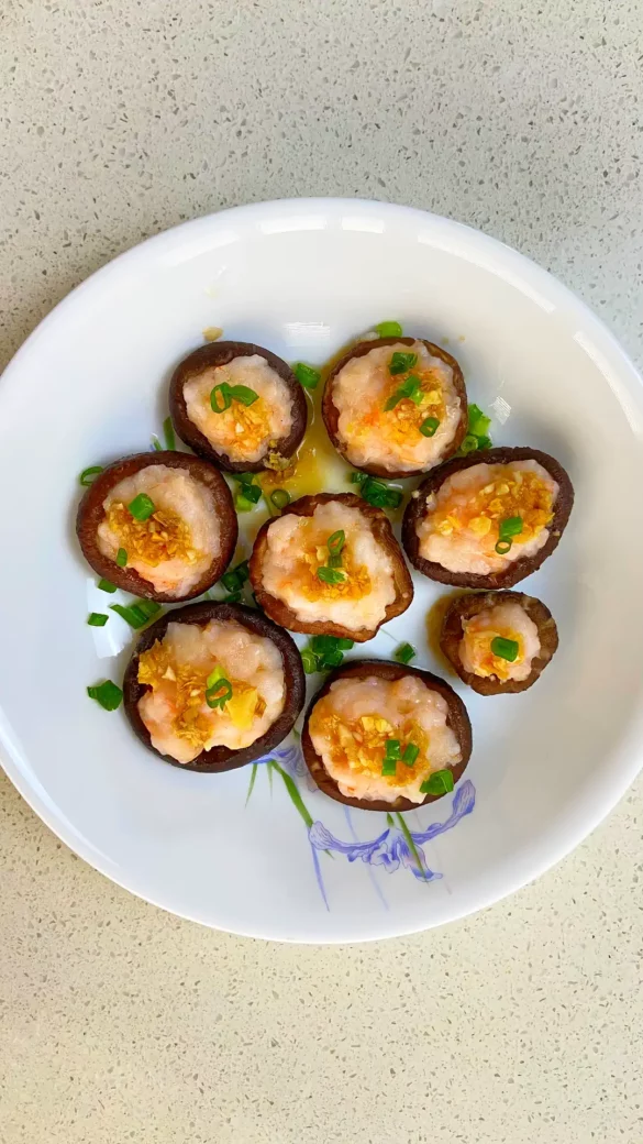 Prawn stuffed shiitake mushrooms, steamed to perfection with a sweet savoury sauce