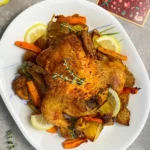 Juicy Christmas Roast Chicken with carrots and potatoes